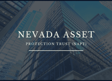 Graphic with text "Nevada Asset Protection Trust (NAPT)" overlaid on an image showing the reflective glass facades of towering skyscrapers converging towards the sky.