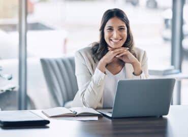 Attorney, portrait and laptop in office consulting, legal planning or policy review feedback in cor.