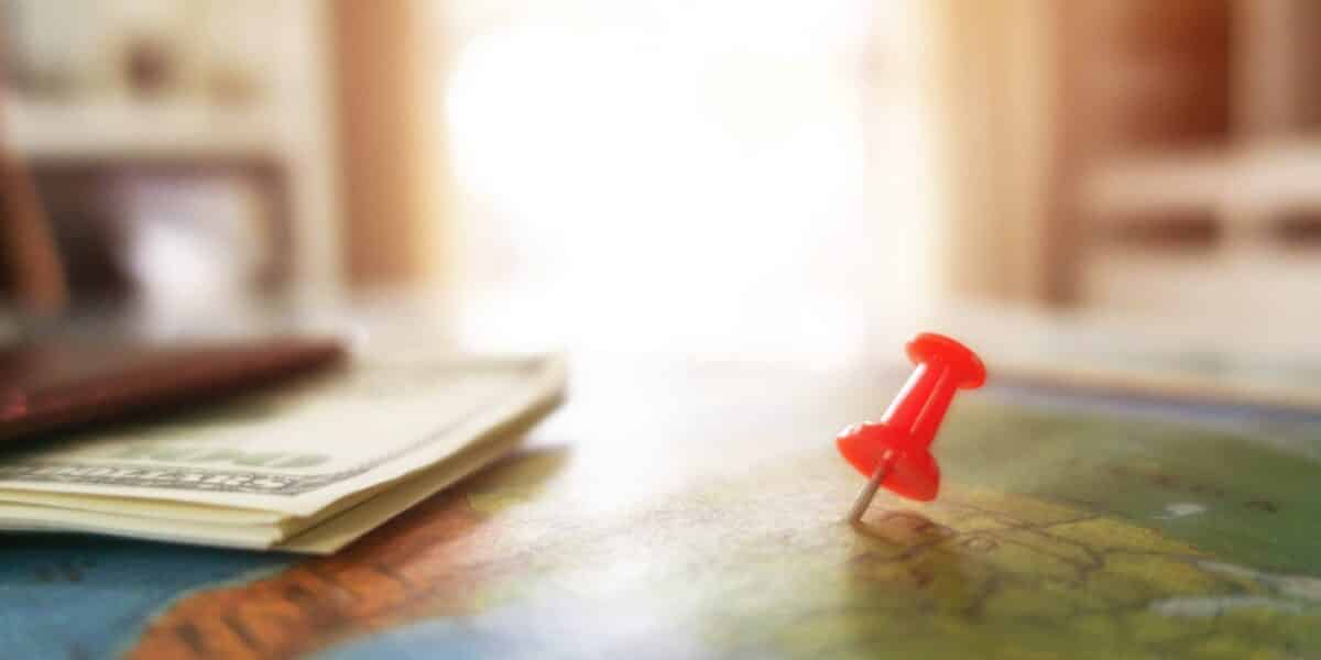 red pin on the map for money