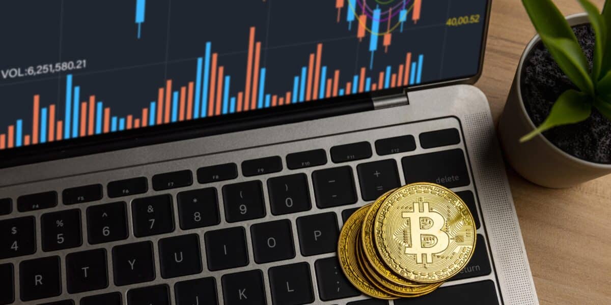 Close up bitcoin on laptop on table at home, cryptocurrency profit and income from investing in stock to exchange crypto and pay to buy in financial technology market investor in e-commerce concept